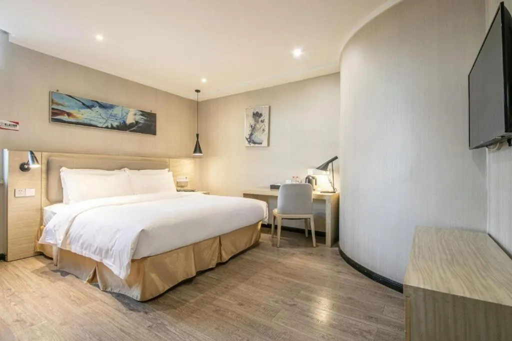 Bed in Borrman Hotel Wuhan Yangluo Metro Station Shenshuigang