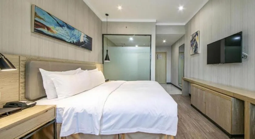 Bed in Borrman Hotel Wuhan Yangluo Metro Station Shenshuigang