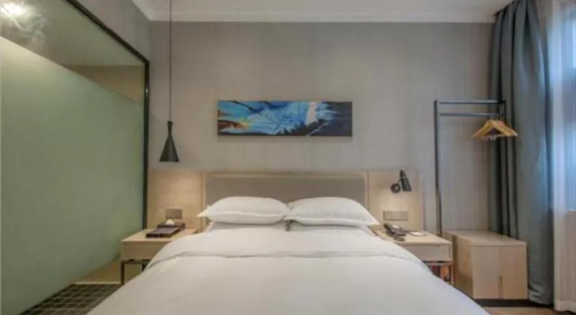 Bed in Borrman Hotel Wuhan Yangluo Metro Station Shenshuigang