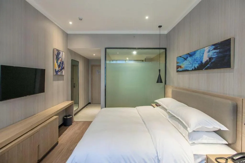 Bed in Borrman Hotel Wuhan Yangluo Metro Station Shenshuigang