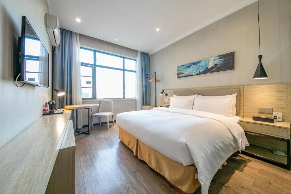 Bed in Borrman Hotel Wuhan Yangluo Metro Station Shenshuigang