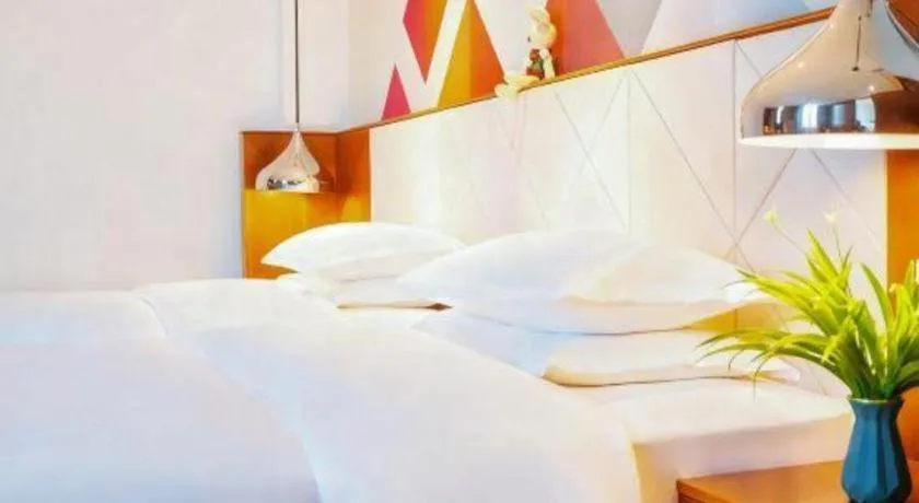 Bed in Borrman Hotel Zhongxiang Railway Station Mochou Village