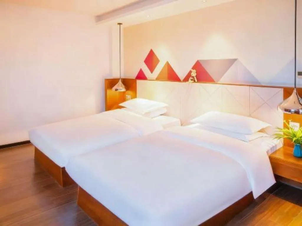 Bed in Borrman Hotel Zhongxiang Railway Station Mochou Village