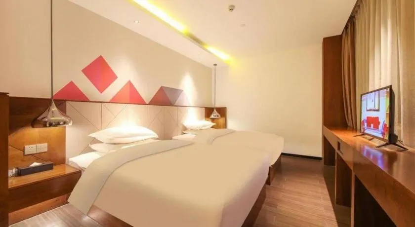 Bed in Borrman Hotel Zhongxiang Railway Station Mochou Village