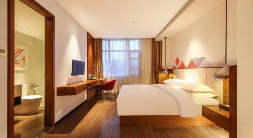 Bed in Borrman Hotel Zhongxiang Railway Station Mochou Village