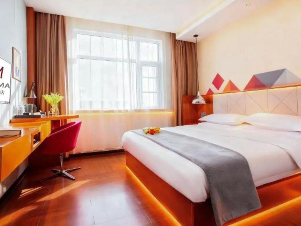 Bed in Borrman Hotel Zhongxiang Railway Station Mochou Village