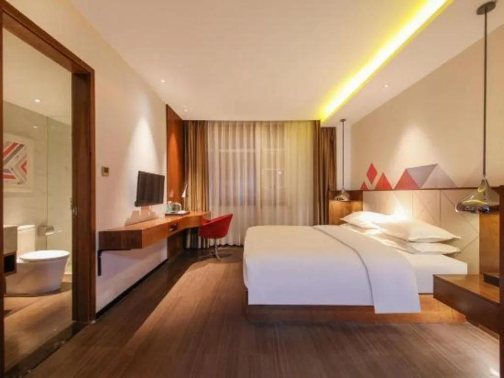 Bed in Borrman Hotel Zhongxiang Railway Station Mochou Village