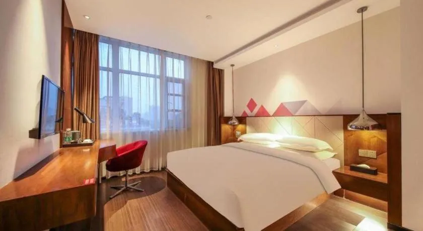 Bed in Borrman Hotel Zhongxiang Railway Station Mochou Village