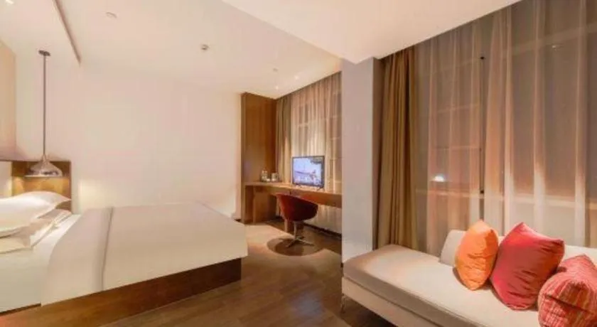 Bed in Borrman Hotel Zhongxiang Railway Station Mochou Village