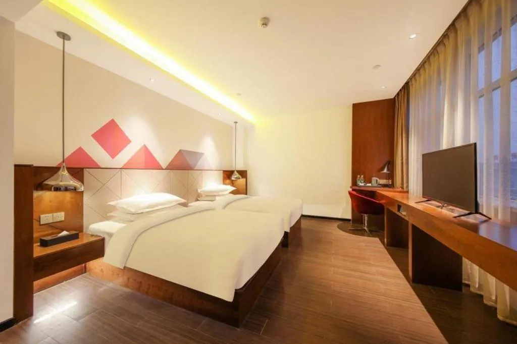 Bed in Borrman Hotel Zhongxiang Railway Station Mochou Village