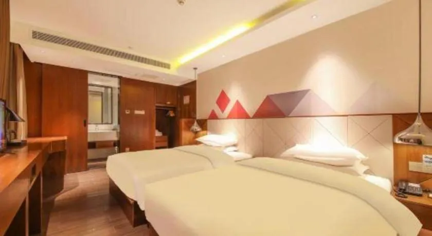 Bed in Borrman Hotel Zhongxiang Railway Station Mochou Village