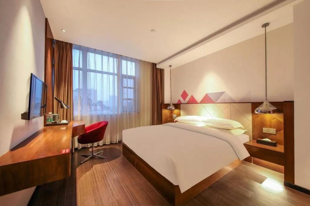 Bed in Borrman Hotel Zhongxiang Railway Station Mochou Village