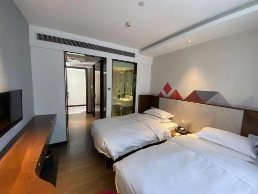 Bed in Borrman Hotel Zhongxiang Railway Station Mochou Village