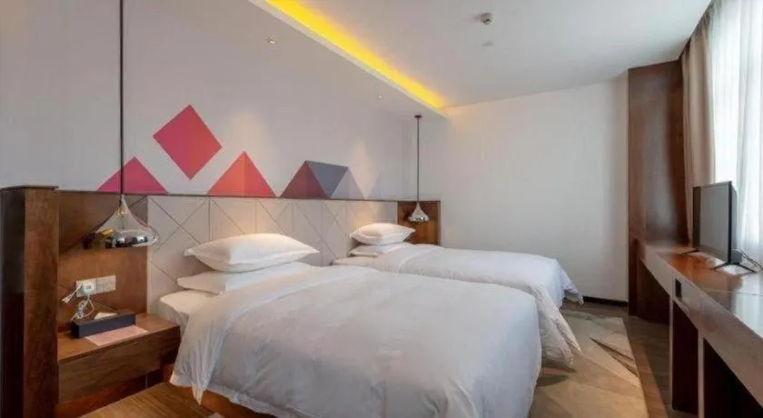 Bed in Borrman Hotel Zhongxiang Railway Station Mochou Village