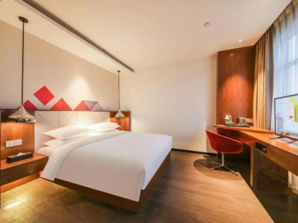 Bed in Borrman Hotel Zhongxiang Railway Station Mochou Village