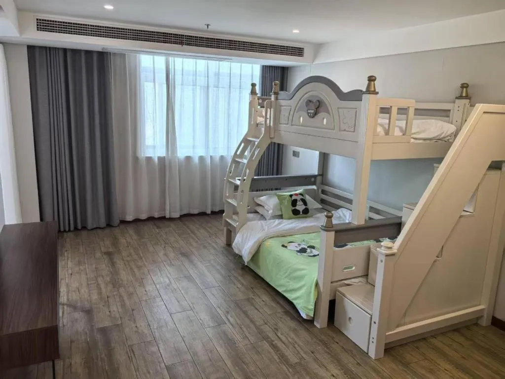 Bed in Borrman Hotel East Huai'an Railway Station Zhou 'Enlai Memorial