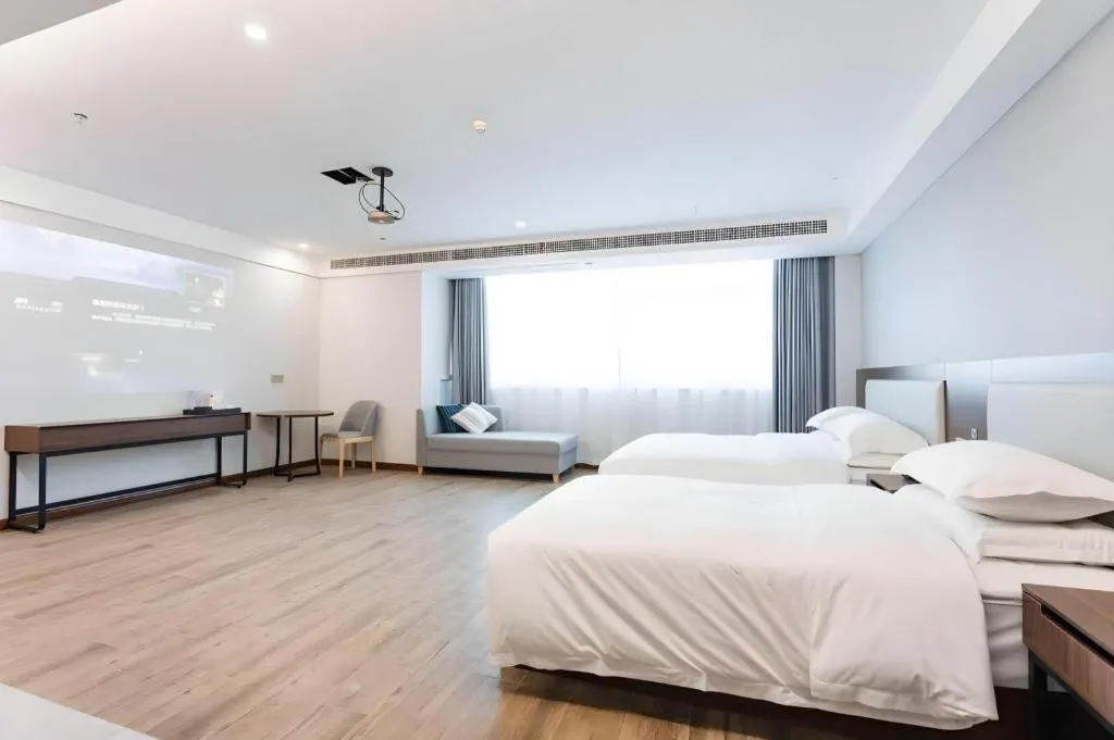 Bed in Borrman Hotel East Huai'an Railway Station Zhou 'Enlai Memorial