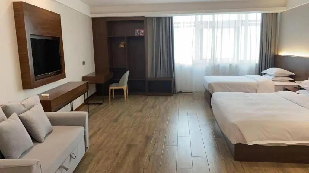 Bed in Borrman Hotel East Huai'an Railway Station Zhou 'Enlai Memorial