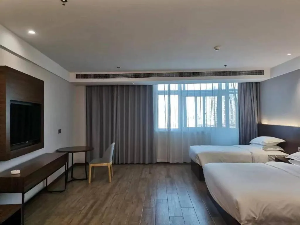 Bed in Borrman Hotel East Huai'an Railway Station Zhou 'Enlai Memorial