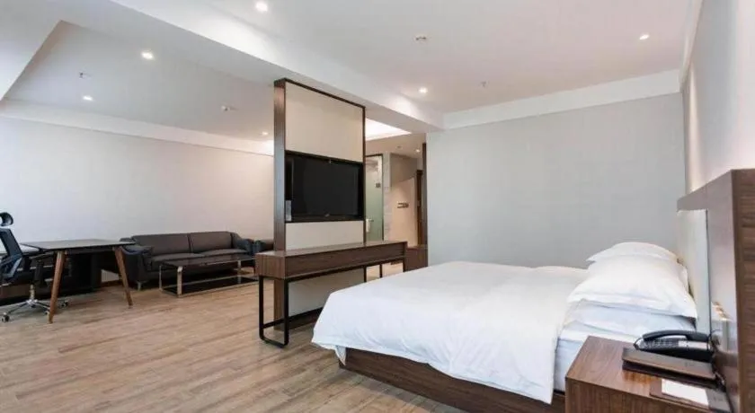 Bed in Borrman Hotel East Huai'an Railway Station Zhou 'Enlai Memorial