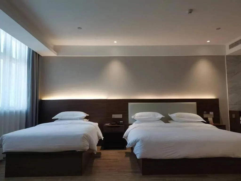 Bed in Borrman Hotel East Huai'an Railway Station Zhou 'Enlai Memorial