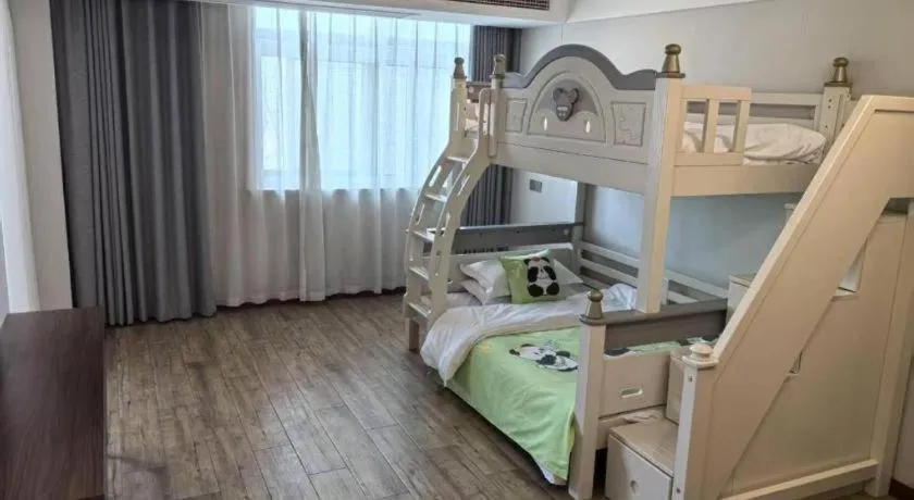 Bed in Borrman Hotel East Huai'an Railway Station Zhou 'Enlai Memorial