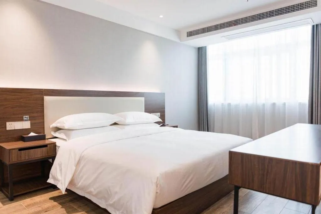 Bed in Borrman Hotel East Huai'an Railway Station Zhou 'Enlai Memorial