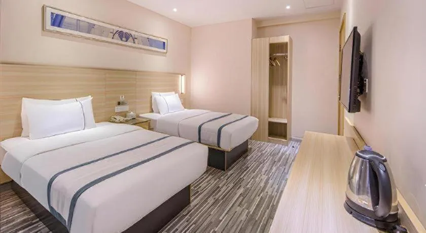 Bed in JTOUR Inn Wuzhou Arcade City Sanzongfu