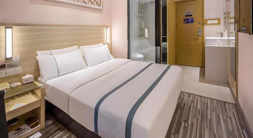Bed in JTOUR Inn Wuzhou Arcade City Sanzongfu