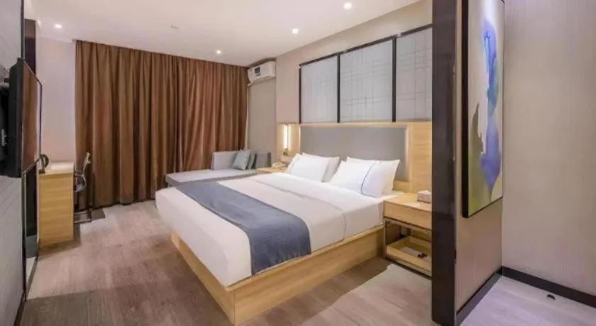 Bed in JTOUR Inn Wuzhou Arcade City Sanzongfu