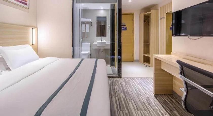 Bed in JTOUR Inn Wuzhou Arcade City Sanzongfu