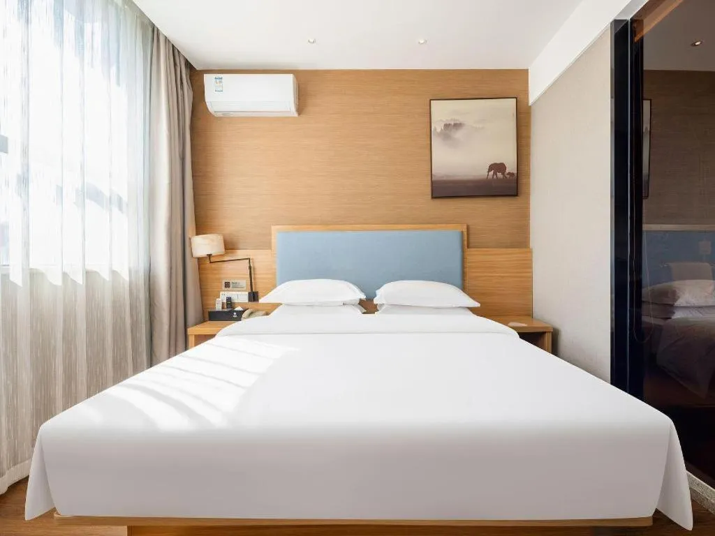 Bed in JTOUR Inn Guigang Life Port High-speed Railway Station