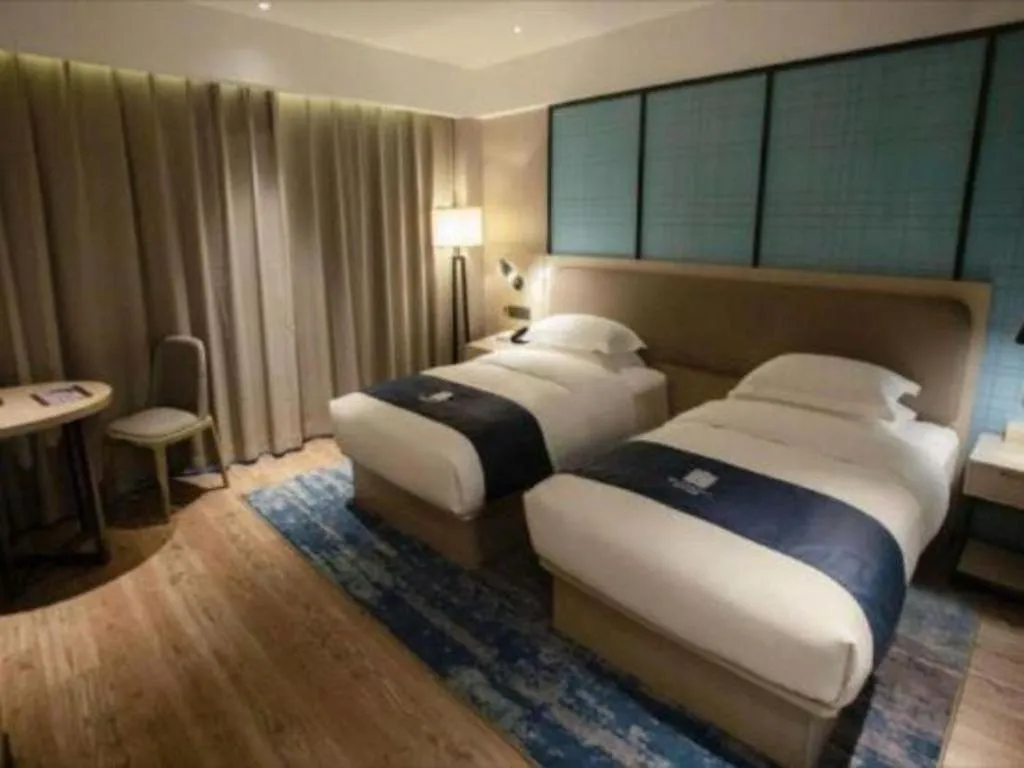 Bed in Echarm Hotel Jianshui Gucheng