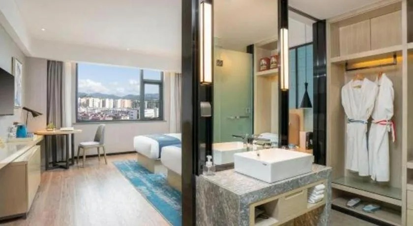 Bed in Echarm Hotel Jianshui Gucheng