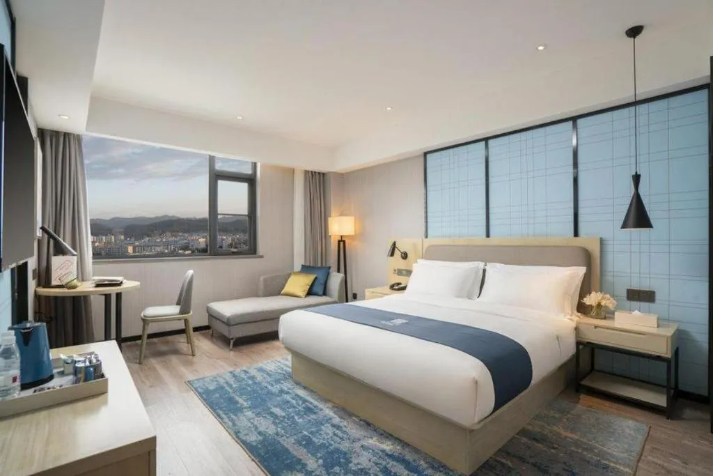 Bed in Echarm Hotel Jianshui Gucheng