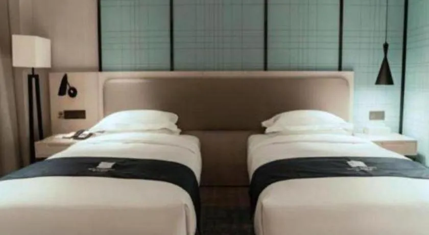 Bed in Echarm Hotel Jianshui Gucheng