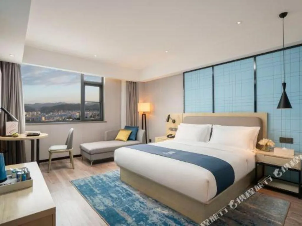 Bed in Echarm Hotel Jianshui Gucheng