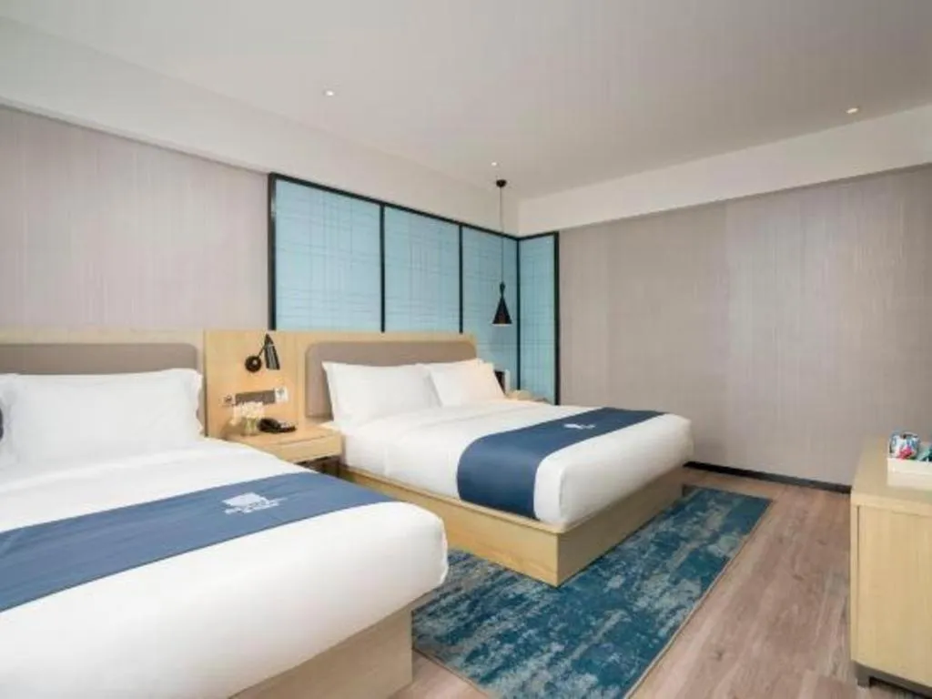 Bed in Echarm Hotel Jianshui Gucheng