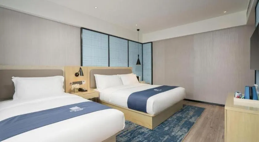 Bed in Echarm Hotel Jianshui Gucheng