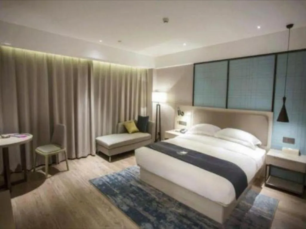 Bed in Echarm Hotel Jianshui Gucheng