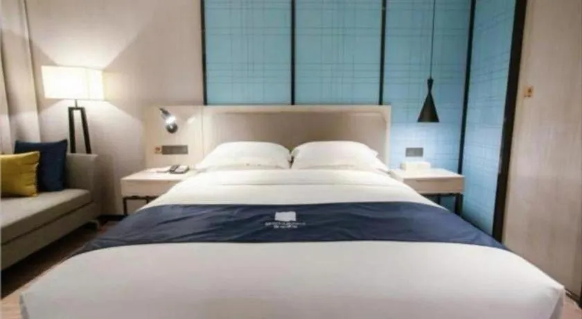 Bed in Echarm Hotel Jianshui Gucheng