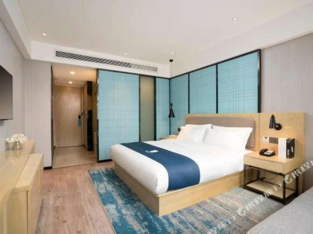 Bed in Echarm Hotel Jianshui Gucheng