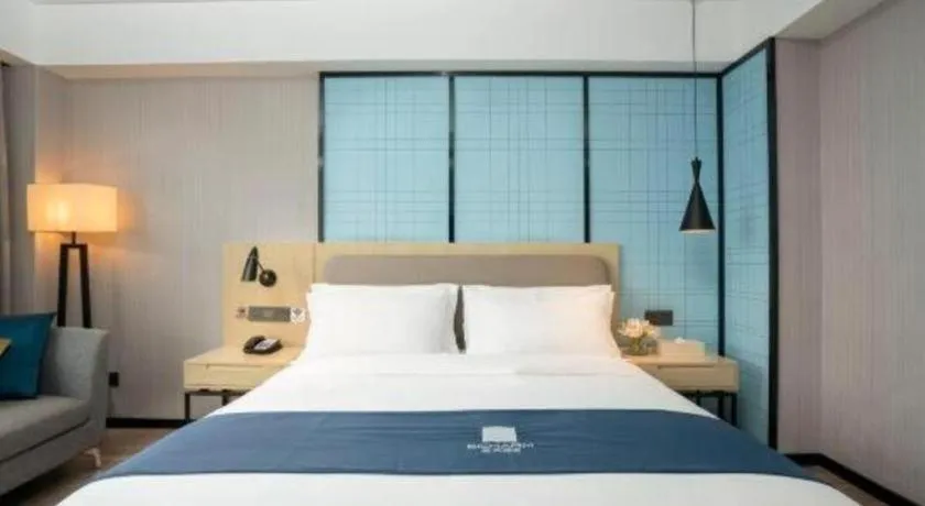 Bed in Echarm Hotel Jianshui Gucheng