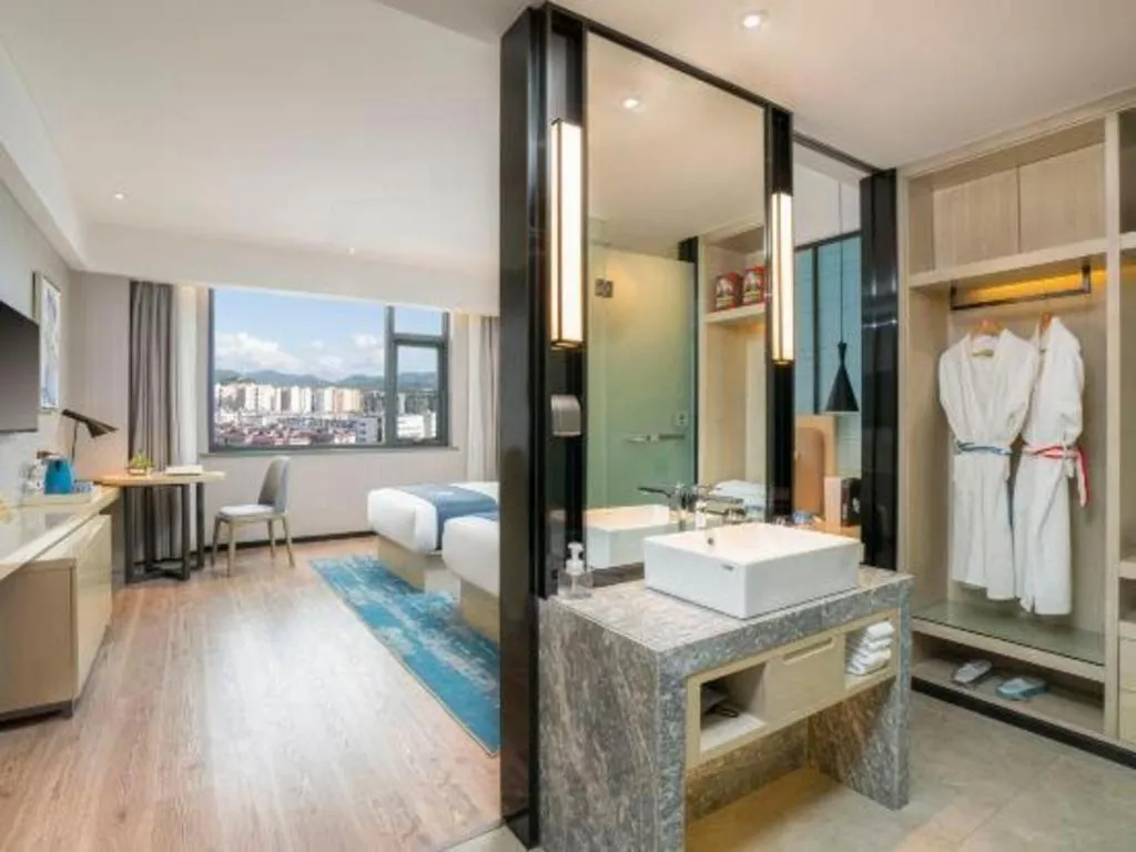 Bed in Echarm Hotel Jianshui Gucheng