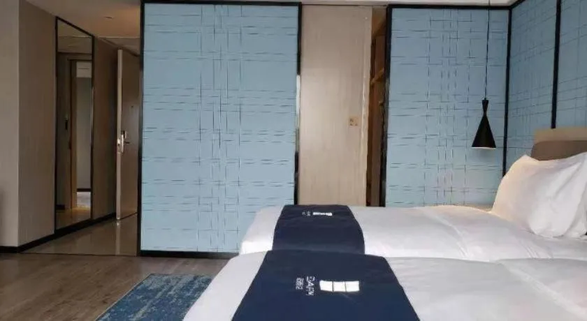 Bed in Echarm Hotel Jianshui Gucheng