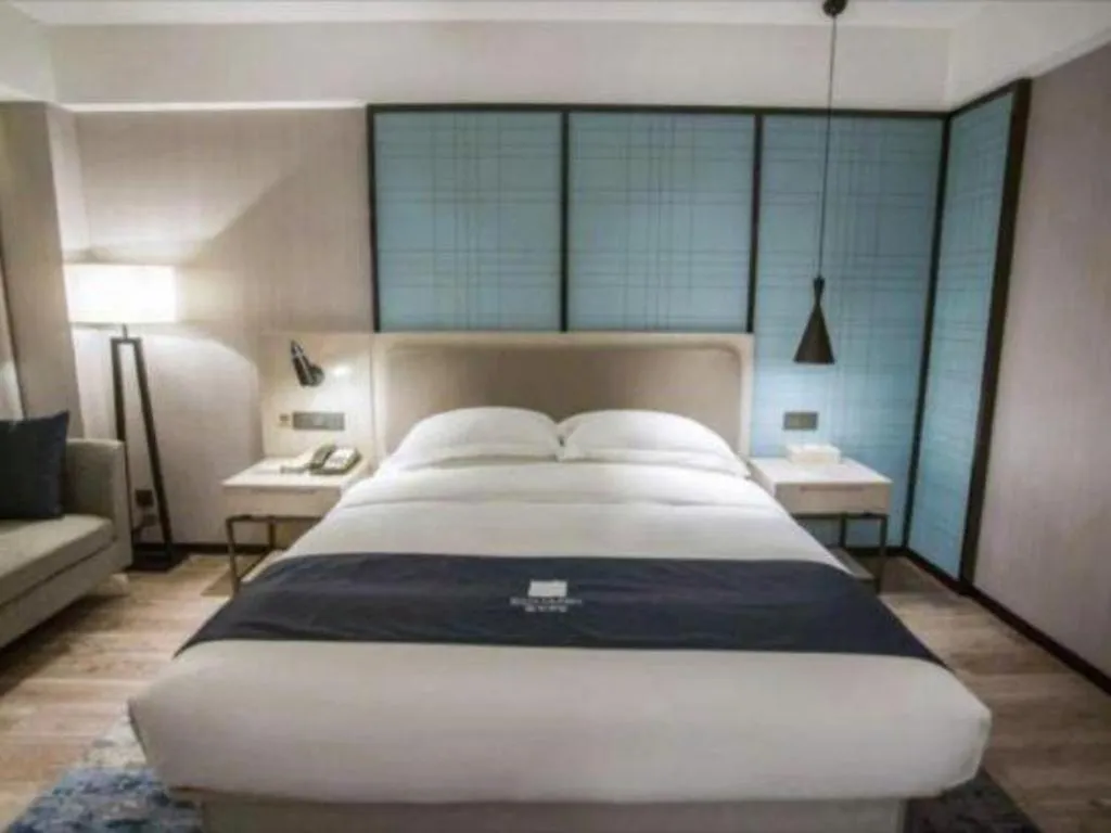 Bed in Echarm Hotel Jianshui Gucheng