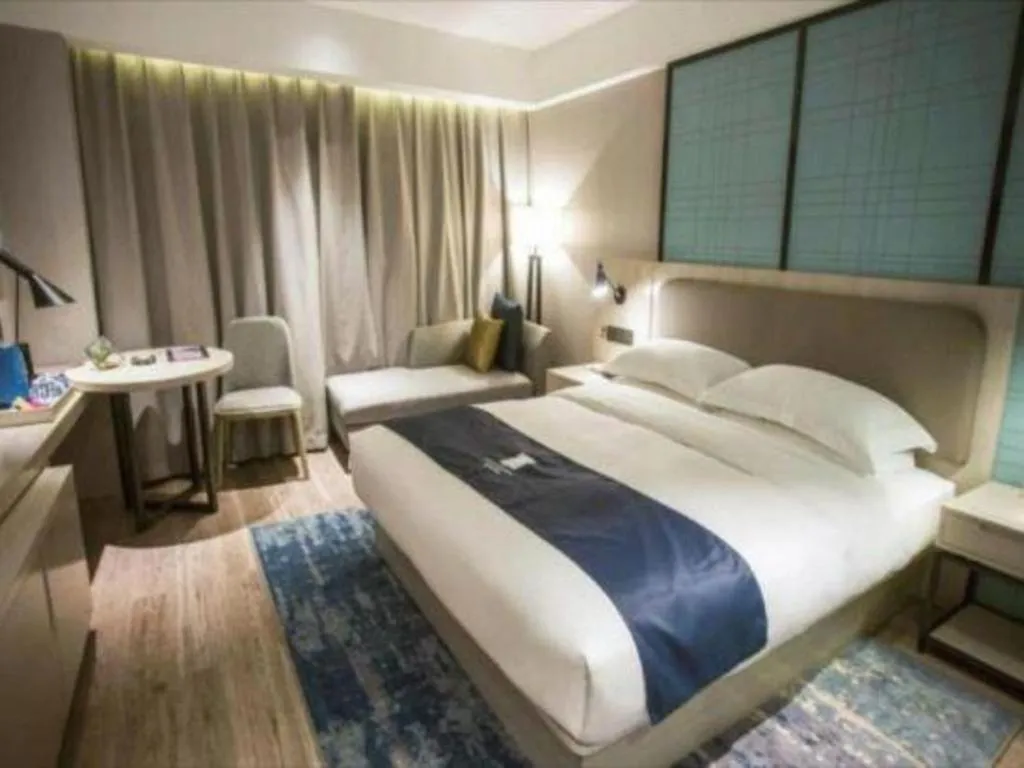 Bed in Echarm Hotel Jianshui Gucheng