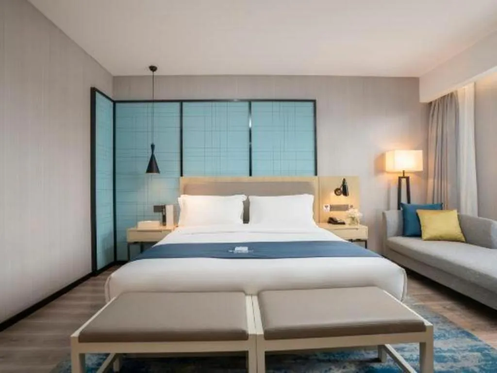 Bed in Echarm Hotel Jianshui Gucheng