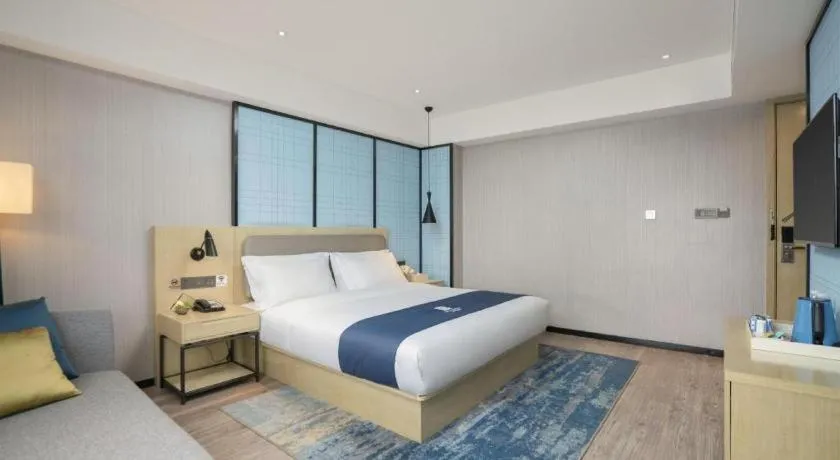 Bed in Echarm Hotel Jianshui Gucheng