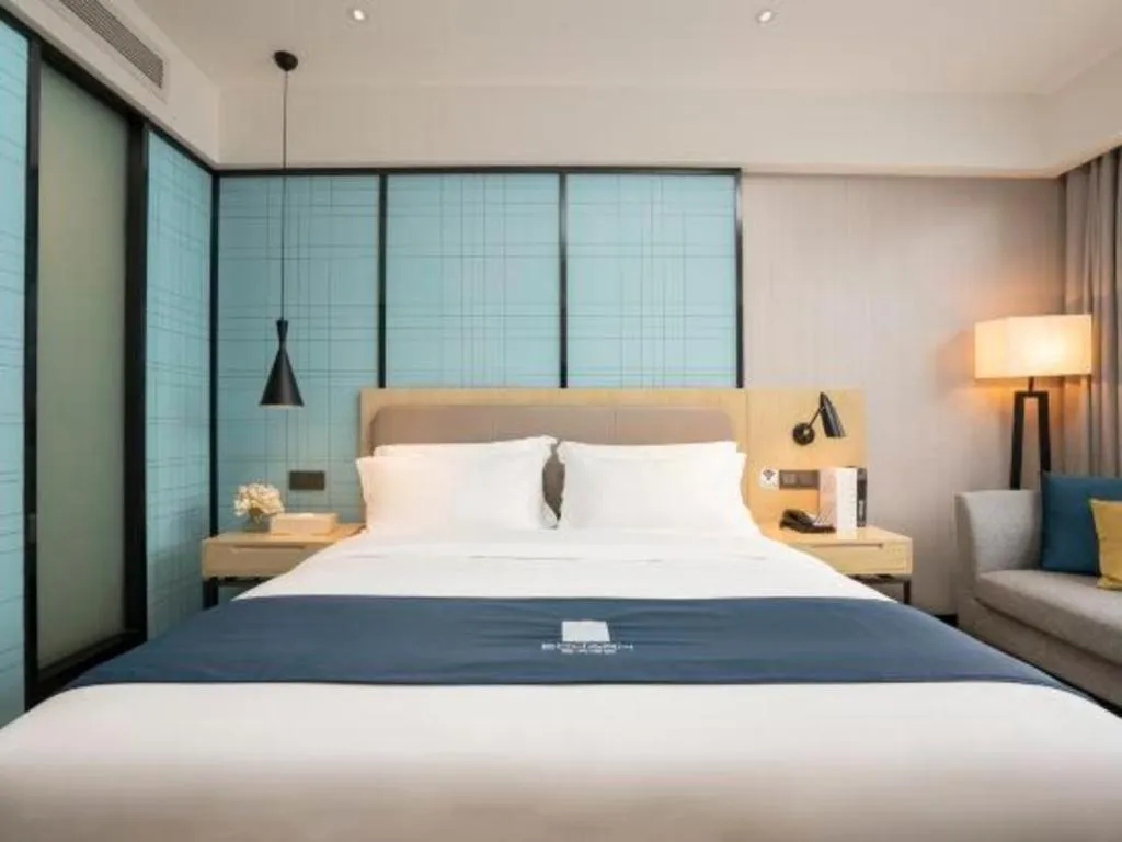 Bed in Echarm Hotel Jianshui Gucheng